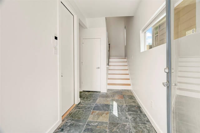 2232 Leeland St, Houston, TX 77003 - hallway featuring stone tile floors and stairs