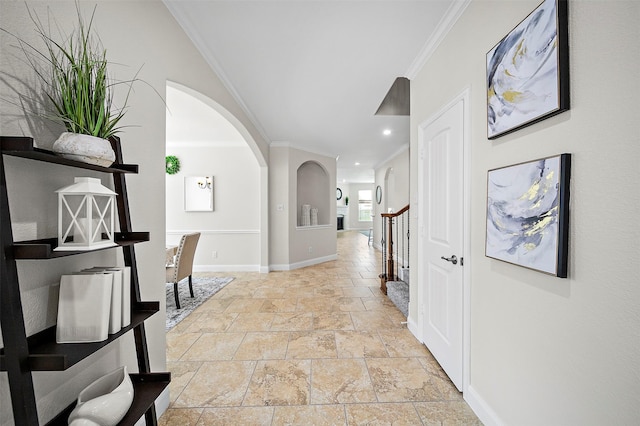 27910 Wedgeoak Ct, Katy, TX 77494 - hall with arched walkways, stone tile flooring, crown molding, recessed lighting, and stairway