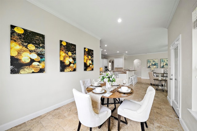 27910 Wedgeoak Ct, Katy, TX 77494 - dining room with arched walkways, recessed lighting, and ornamental molding