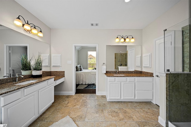 27910 Wedgeoak Ct, Katy, TX 77494 - full bath featuring a shower stall, two vanities, stone tile flooring, and connected bathroom