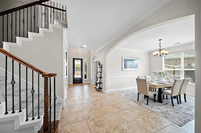 27910 Wedgeoak Ct, Katy, TX 77494 - dining space featuring arched walkways, stairs, a chandelier, plenty of natural light, and ornamental molding