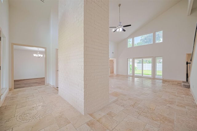 982 W Donovan St, Houston, TX 77091 - hall with high vaulted ceiling, stone tile flooring, and a chandelier