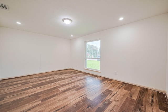 982 W Donovan St, Houston, TX 77091 - unfurnished room with hardwood / wood-style floors and recessed lighting
