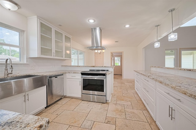 982 W Donovan St, Houston, TX 77091 - kitchen with stainless steel appliances, stone tile floors, island range hood, recessed lighting, and plenty of natural light