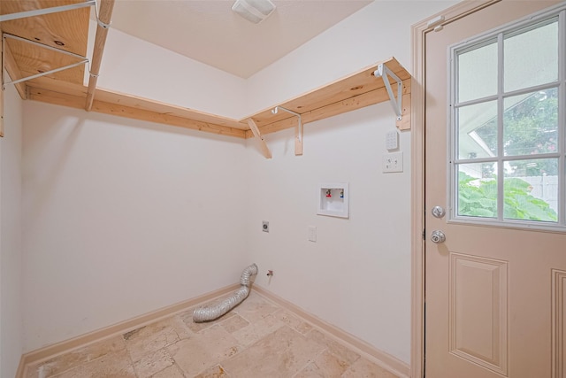 982 W Donovan St, Houston, TX 77091 - laundry room featuring electric dryer hookup, hookup for a washing machine, light stone finish floors, and hookup for a gas dryer