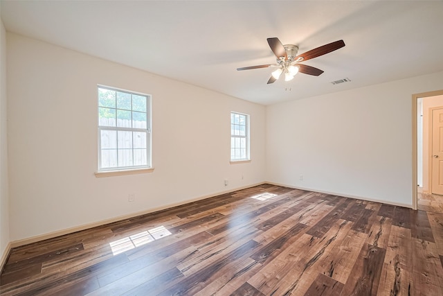 982 W Donovan St, Houston, TX 77091 - unfurnished room featuring dark wood-style flooring and a ceiling fan