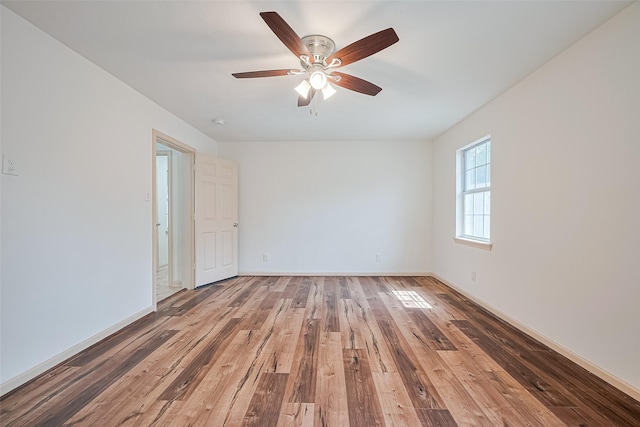 982 W Donovan St, Houston, TX 77091 - empty room featuring wood finished floors and ceiling fan