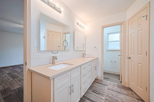 982 W Donovan St, Houston, TX 77091 - full bathroom with double vanity and backsplash