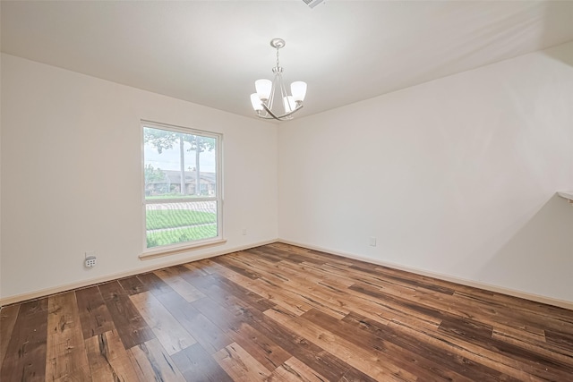982 W Donovan St, Houston, TX 77091 - spare room with a chandelier and hardwood / wood-style floors