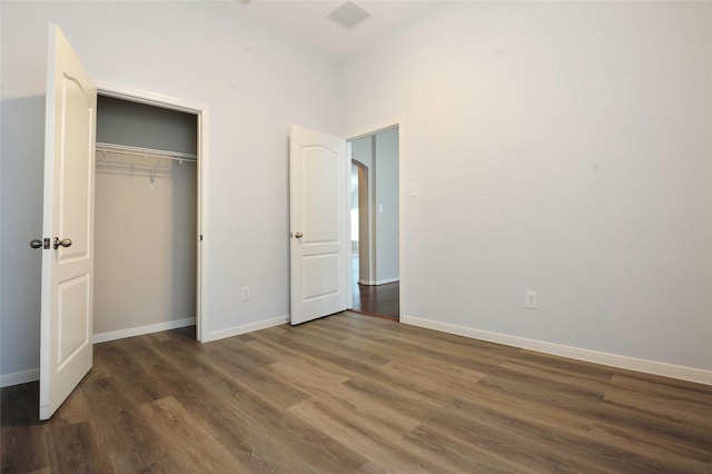 8022 Thorncroft Manor Ln, Richmond, TX 77407 - unfurnished bedroom with wood finished floors and a closet