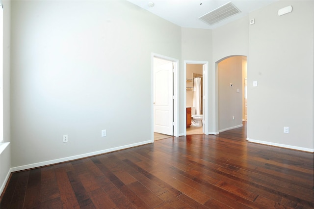 8022 Thorncroft Manor Ln, Richmond, TX 77407 - empty room featuring arched walkways and wood-type flooring