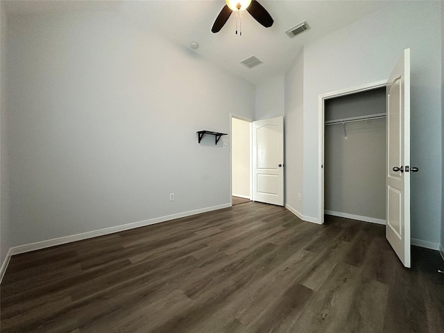 8022 Thorncroft Manor Ln, Richmond, TX 77407 - unfurnished bedroom with dark wood-type flooring, lofted ceiling, a closet, and a ceiling fan