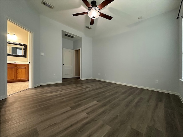 8022 Thorncroft Manor Ln, Richmond, TX 77407 - unfurnished bedroom featuring dark wood-style floors, ensuite bathroom, and ceiling fan