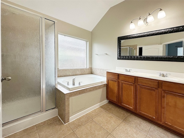 8022 Thorncroft Manor Ln, Richmond, TX 77407 - bathroom with lofted ceiling, a shower stall, a bath, double vanity, and tile patterned floors