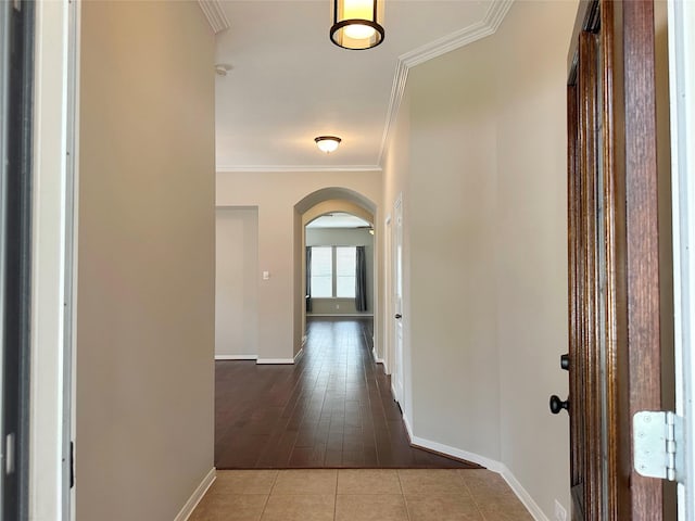 8022 Thorncroft Manor Ln, Richmond, TX 77407 - hall featuring arched walkways, crown molding, and dark tile patterned floors