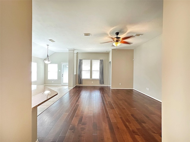 8022 Thorncroft Manor Ln, Richmond, TX 77407 - unfurnished living room with a ceiling fan, dark wood-style floors, and lofted ceiling