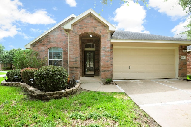 8022 Thorncroft Manor Ln, Richmond, TX 77407 - view of front facade featuring concrete driveway, brick siding, and a garage