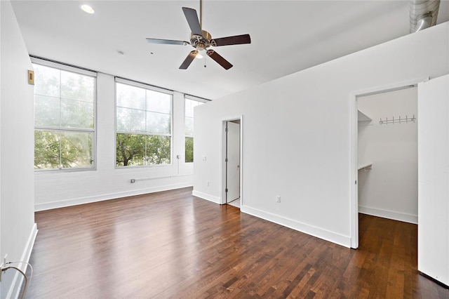 1312 Live Oak St Unit 215, Houston, TX 77003 - unfurnished bedroom featuring wood finished floors, a spacious closet, a ceiling fan, and recessed lighting