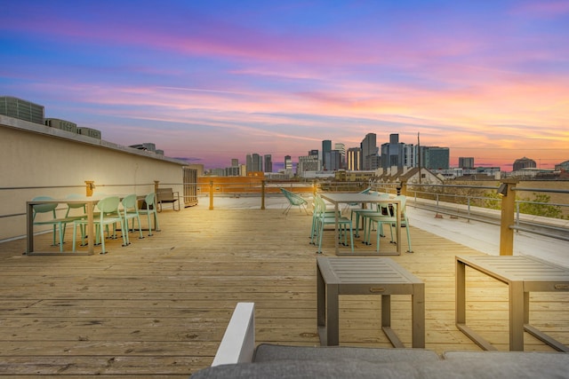 1312 Live Oak St Unit 215, Houston, TX 77003 - wooden terrace featuring a skyline view and outdoor dining space