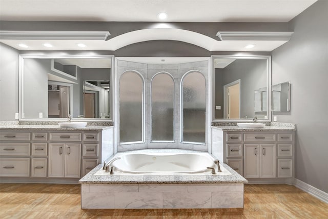 15510 Marble Canyon Way, Houston, TX 77044 - full bathroom featuring two vanities, a whirlpool tub, and recessed lighting