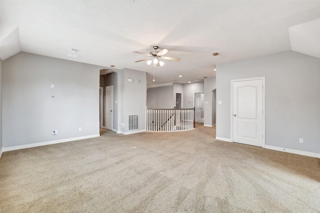 15510 Marble Canyon Way, Houston, TX 77044 - unfurnished living room with arched walkways, ceiling fan, lofted ceiling, and carpet flooring