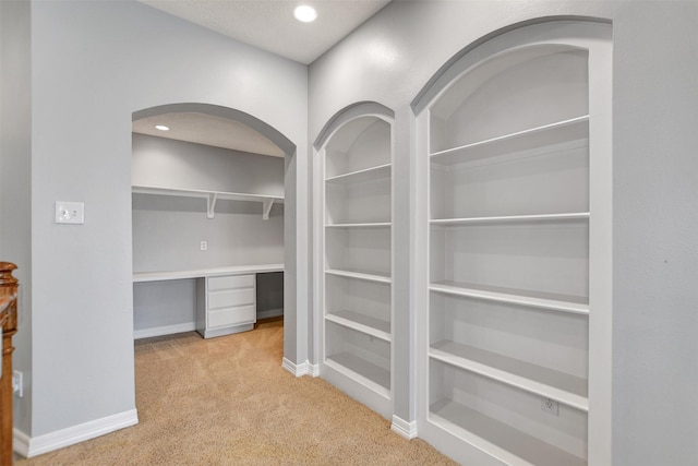 15510 Marble Canyon Way, Houston, TX 77044 - interior space with light colored carpet, arched walkways, and recessed lighting