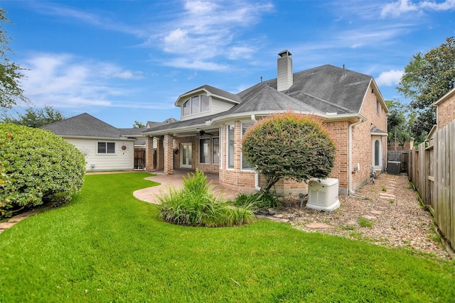 15510 Marble Canyon Way, Houston, TX 77044 - rear view of property featuring brick siding, a fenced backyard, a patio area, a chimney, and ceiling fan