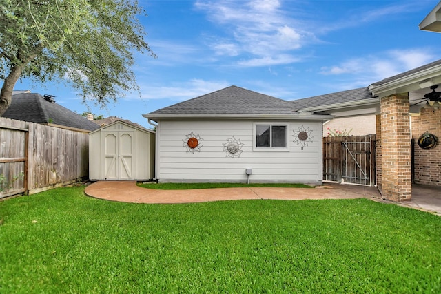15510 Marble Canyon Way, Houston, TX 77044 - rear view of property with a fenced backyard, a storage shed, a shingled roof, and ceiling fan