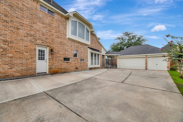 15510 Marble Canyon Way, Houston, TX 77044 - back of property with brick siding and concrete driveway