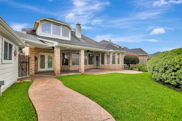 15510 Marble Canyon Way, Houston, TX 77044 - back of house with brick siding, a patio area, a ceiling fan, french doors, and a chimney
