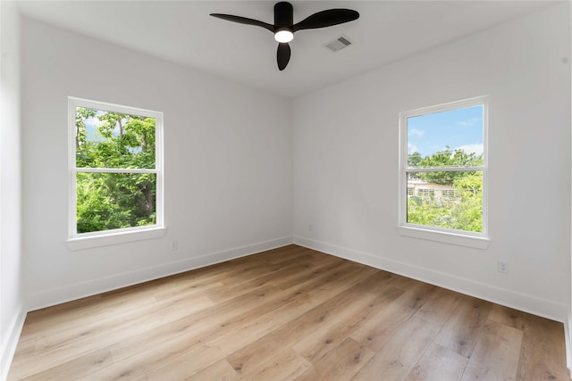 3327 Cornell St Unit A B, Houston, TX 77022 - empty room with healthy amount of natural light, light wood-style flooring, and a ceiling fan