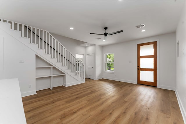 3327 Cornell St Unit A B, Houston, TX 77022 - unfurnished living room featuring stairway, light wood-style floors, ceiling fan, and recessed lighting
