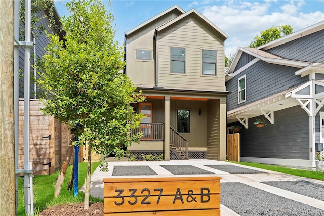 3327 Cornell St Unit A B, Houston, TX 77022 - view of front of house featuring board and batten siding and a porch