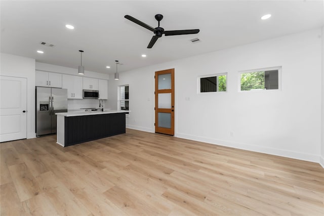 3327 Cornell St Unit A B, Houston, TX 77022 - kitchen featuring appliances with stainless steel finishes, recessed lighting, a ceiling fan, light countertops, and white cabinets