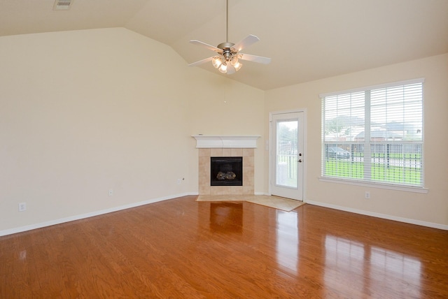 18702 Cypress Loch Dr, Spring, TX 77379 - unfurnished living room featuring a ceiling fan, a fireplace, lofted ceiling, and wood finished floors