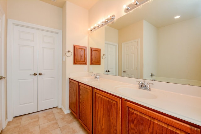 18702 Cypress Loch Dr, Spring, TX 77379 - full bath with double vanity and tile patterned flooring