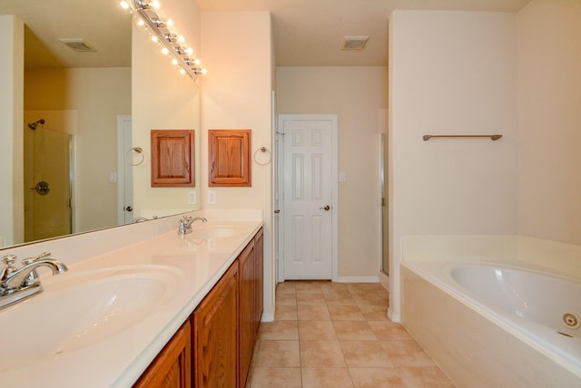 18702 Cypress Loch Dr, Spring, TX 77379 - full bathroom with a stall shower, a bath, double vanity, and tile patterned flooring