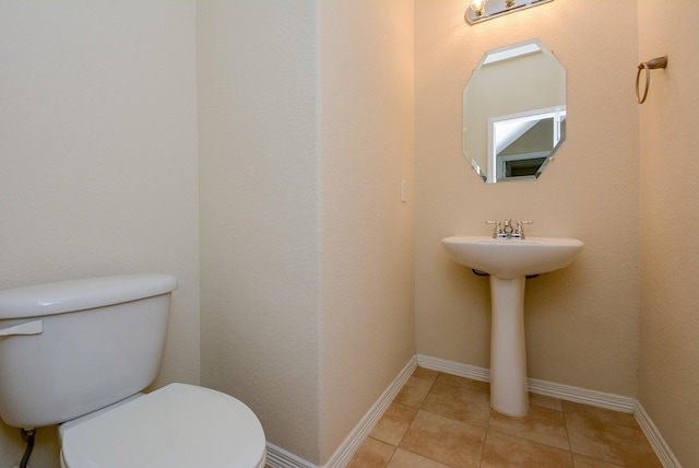 18702 Cypress Loch Dr, Spring, TX 77379 - half bathroom with toilet and tile patterned flooring
