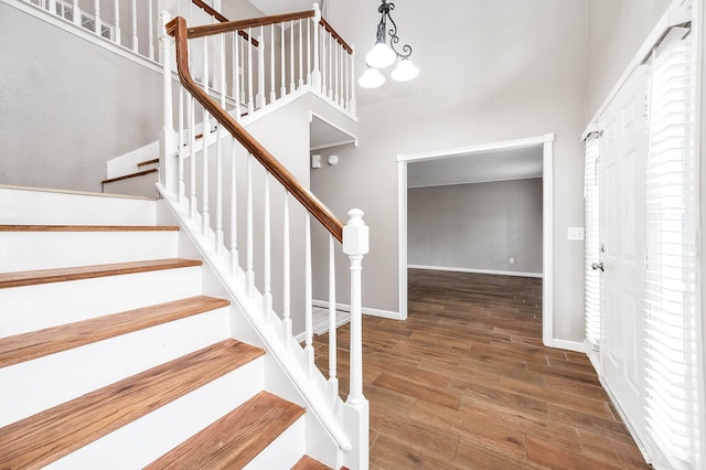 17203 Kettle Creek Dr, Spring, TX 77379 - stairs with wood finished floors and a high ceiling