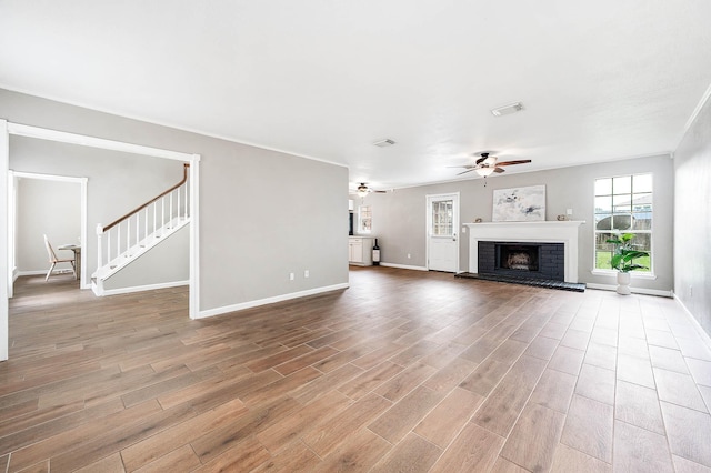 17203 Kettle Creek Dr, Spring, TX 77379 - unfurnished living room with healthy amount of natural light, wood finished floors, and a ceiling fan