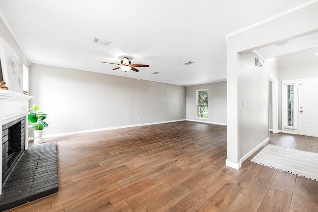 17203 Kettle Creek Dr, Spring, TX 77379 - unfurnished living room featuring a ceiling fan, a brick fireplace, and wood finished floors