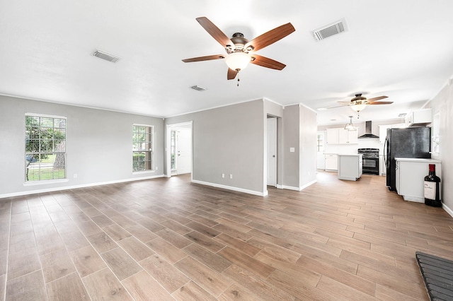 17203 Kettle Creek Dr, Spring, TX 77379 - unfurnished living room featuring a ceiling fan and light wood finished floors