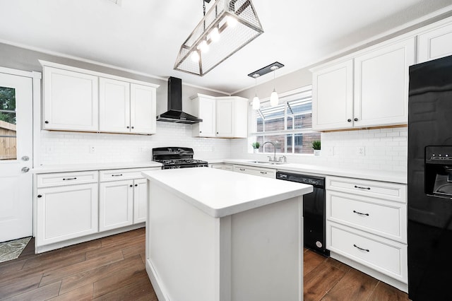 17203 Kettle Creek Dr, Spring, TX 77379 - kitchen with wall chimney range hood, black appliances, white cabinetry, and a center island