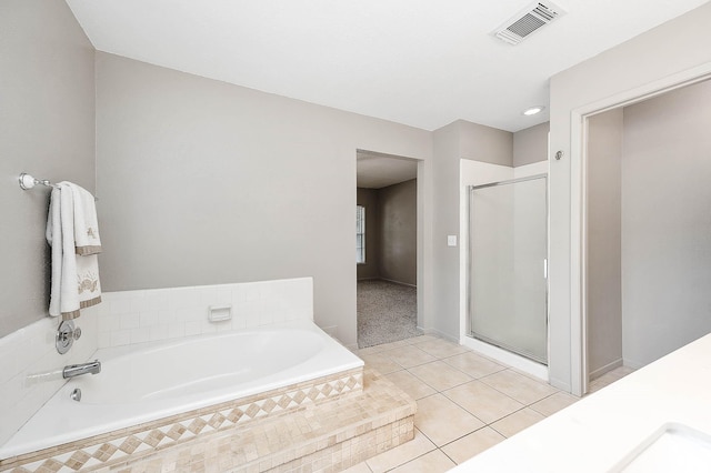 17203 Kettle Creek Dr, Spring, TX 77379 - full bath featuring a bath, a stall shower, and tile patterned floors