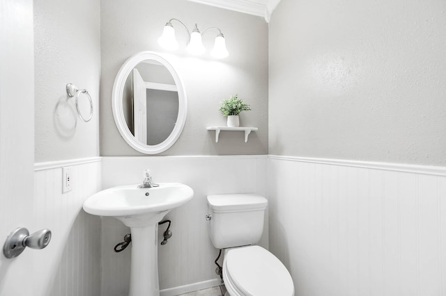 17203 Kettle Creek Dr, Spring, TX 77379 - bathroom with a wainscoted wall and toilet