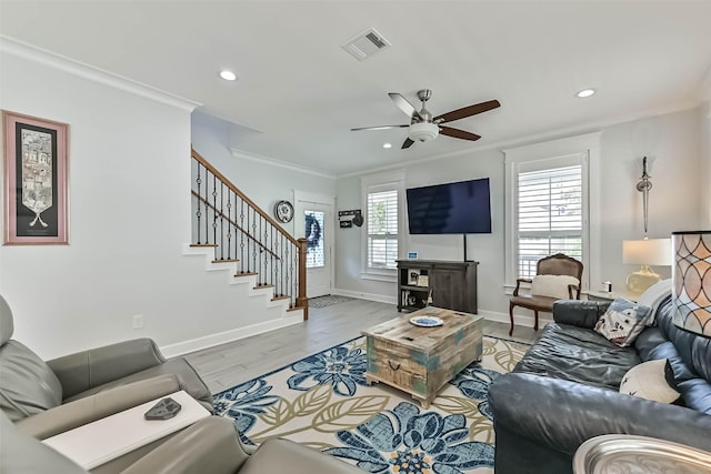 6 Caravelle Ct, Galveston, TX 77554 - living area featuring recessed lighting, ornamental molding, a ceiling fan, stairway, and light wood-style flooring