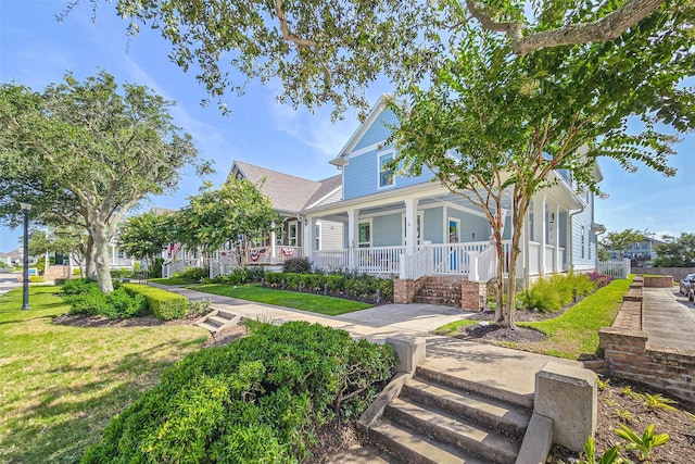 6 Caravelle Ct, Galveston, TX 77554 - view of front of house with covered porch and a front lawn