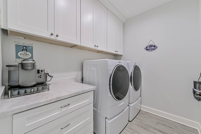 6 Caravelle Ct, Galveston, TX 77554 - laundry room featuring cabinet space, washing machine and dryer, and light wood-style floors