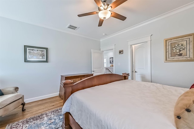 6 Caravelle Ct, Galveston, TX 77554 - bedroom featuring wood finished floors, crown molding, and ceiling fan