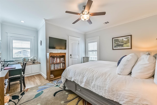 6 Caravelle Ct, Galveston, TX 77554 - bedroom with light wood-style flooring, ornamental molding, a desk, a closet, and ceiling fan